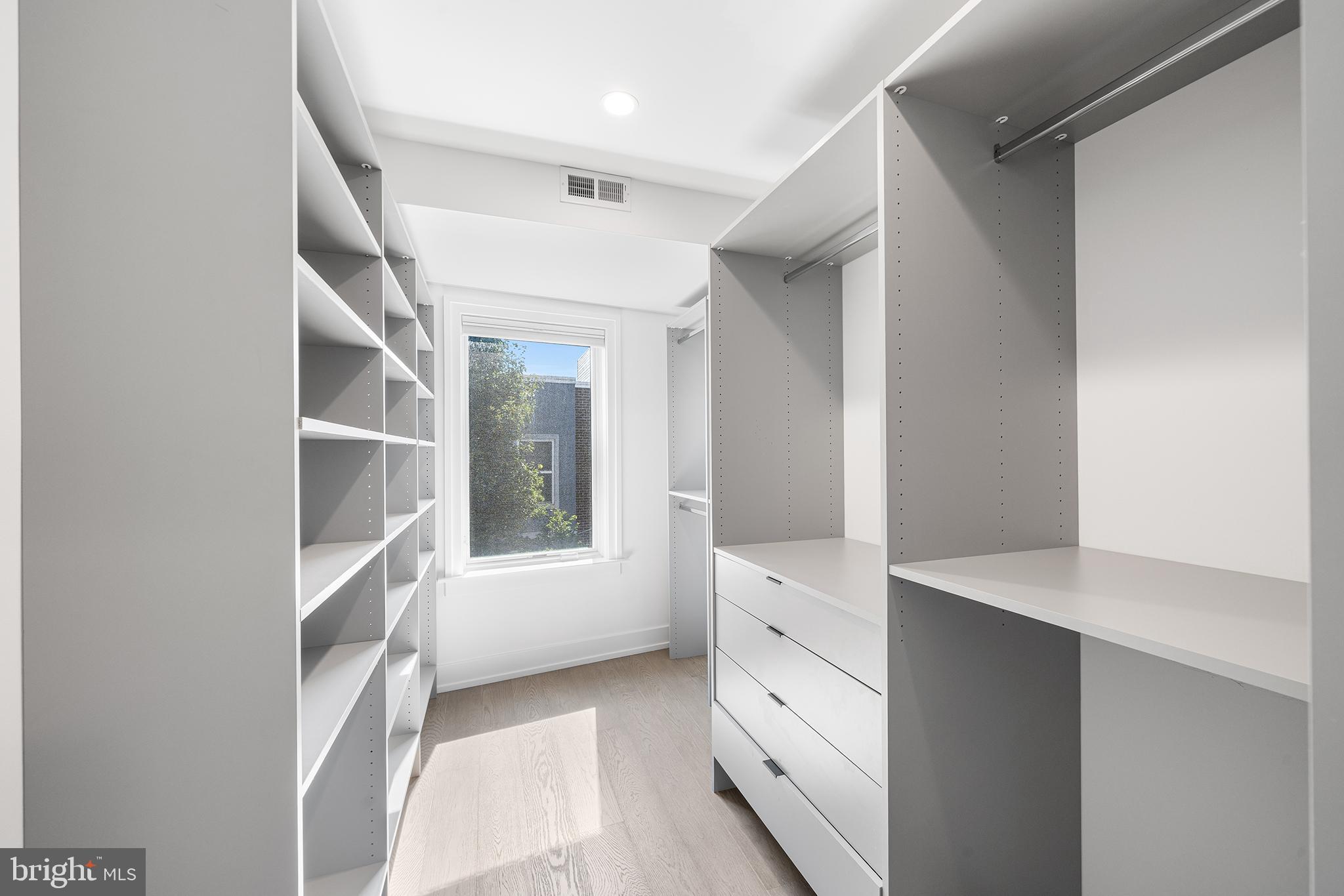 618 South Clarion Street Philadelphia, PA 19147 - Photo 28 of 65 a kitchen with white cabinets and window