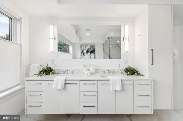 a bathroom with a glass shower door