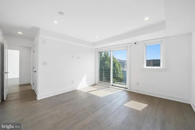 a view of entryway with wooden floor