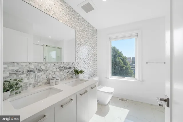 a view of a hallway with white walls