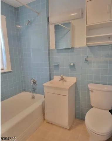 a bathroom with a sink a toilet and bathtub