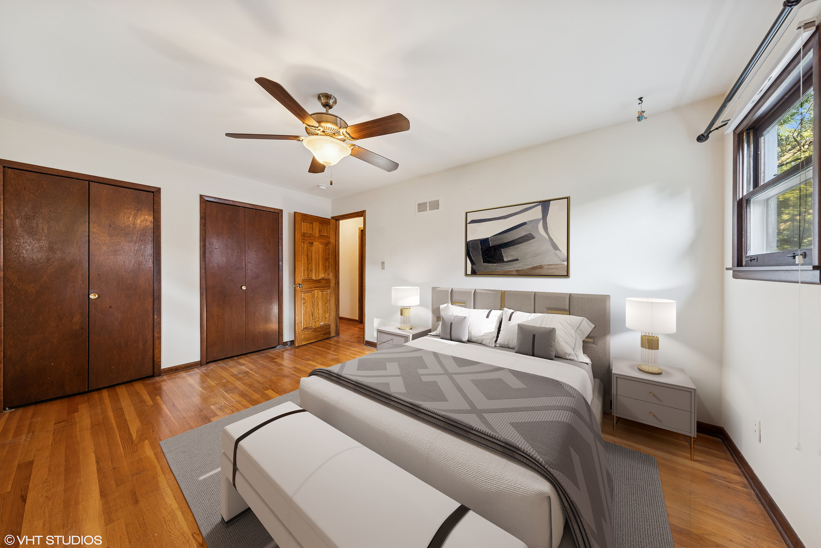 6901 Meadow Crest Drive Downers Grove, IL 60516 - Photo 16 of 42 a bedroom with a bed and a chandelier