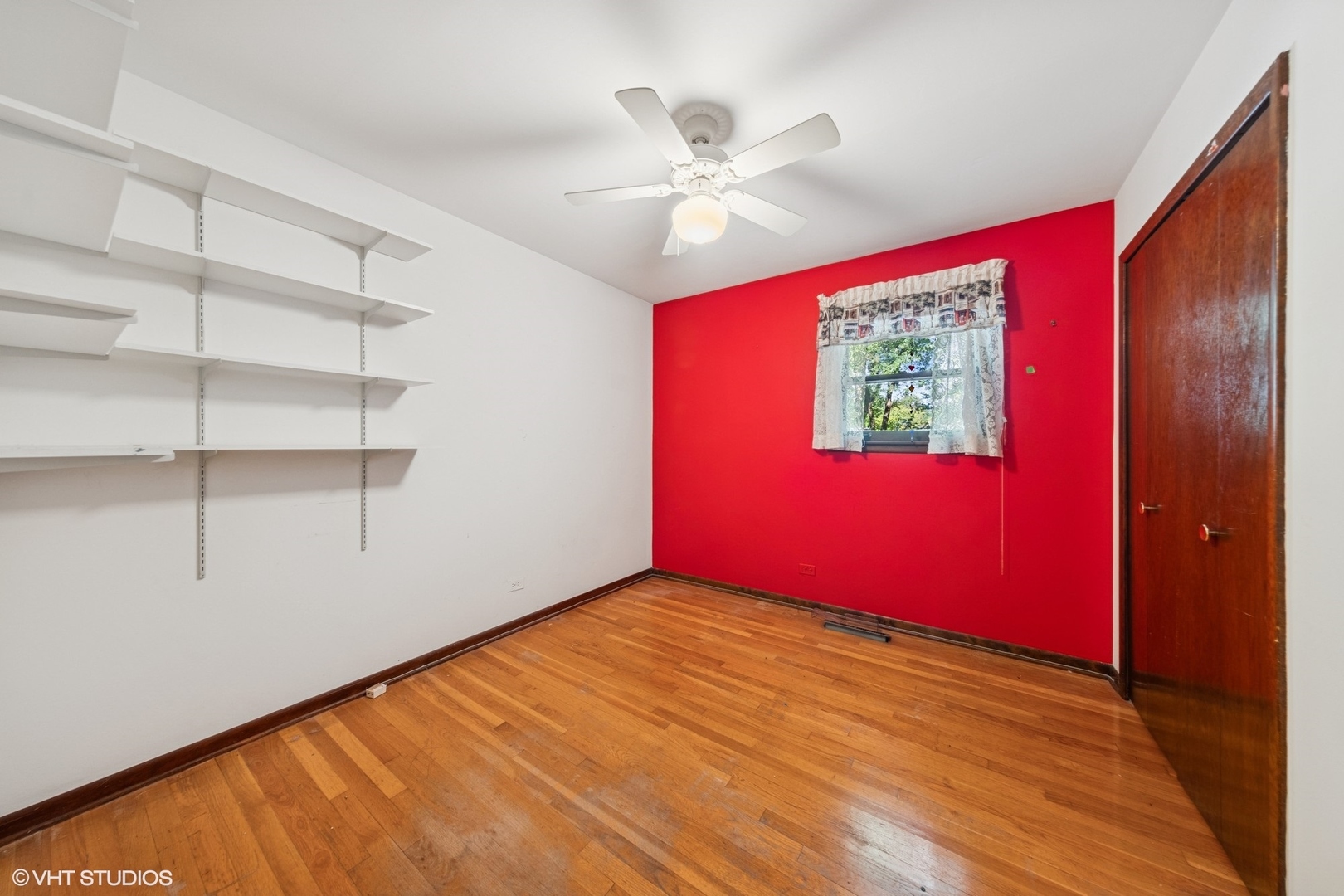 6901 Meadow Crest Drive Downers Grove, IL 60516 - Photo 23 of 42 a view of empty room with wooden floor and fan