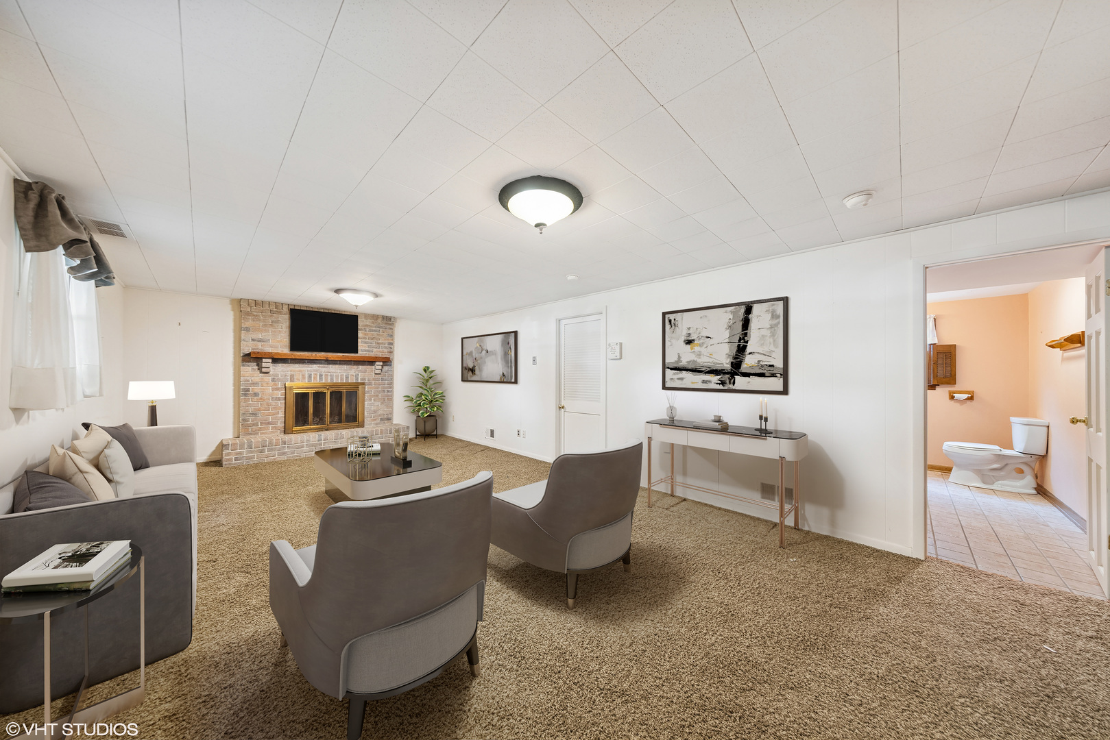6901 Meadow Crest Drive Downers Grove, IL 60516 - Photo 26 of 42 a living room with furniture a fireplace and a flat screen tv