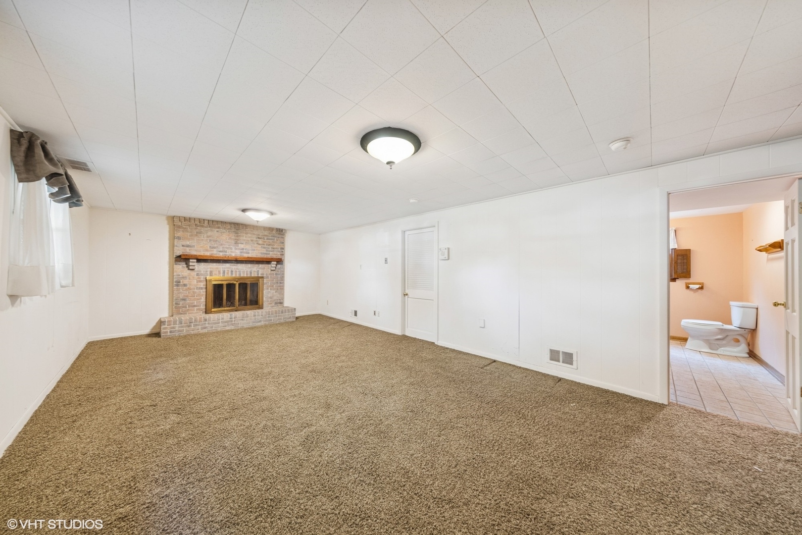 6901 Meadow Crest Drive Downers Grove, IL 60516 - Photo 27 of 42 a view of empty room with a fireplace