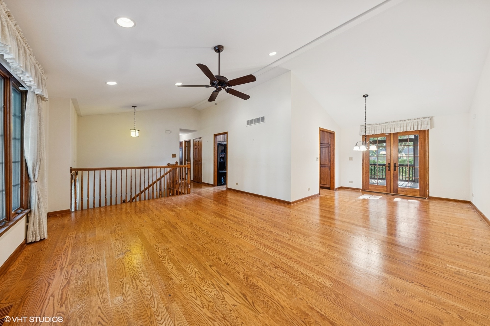 6901 Meadow Crest Drive Downers Grove, IL 60516 - Photo 7 of 42 a view of a livingroom with a ceiling fan and wooden floor