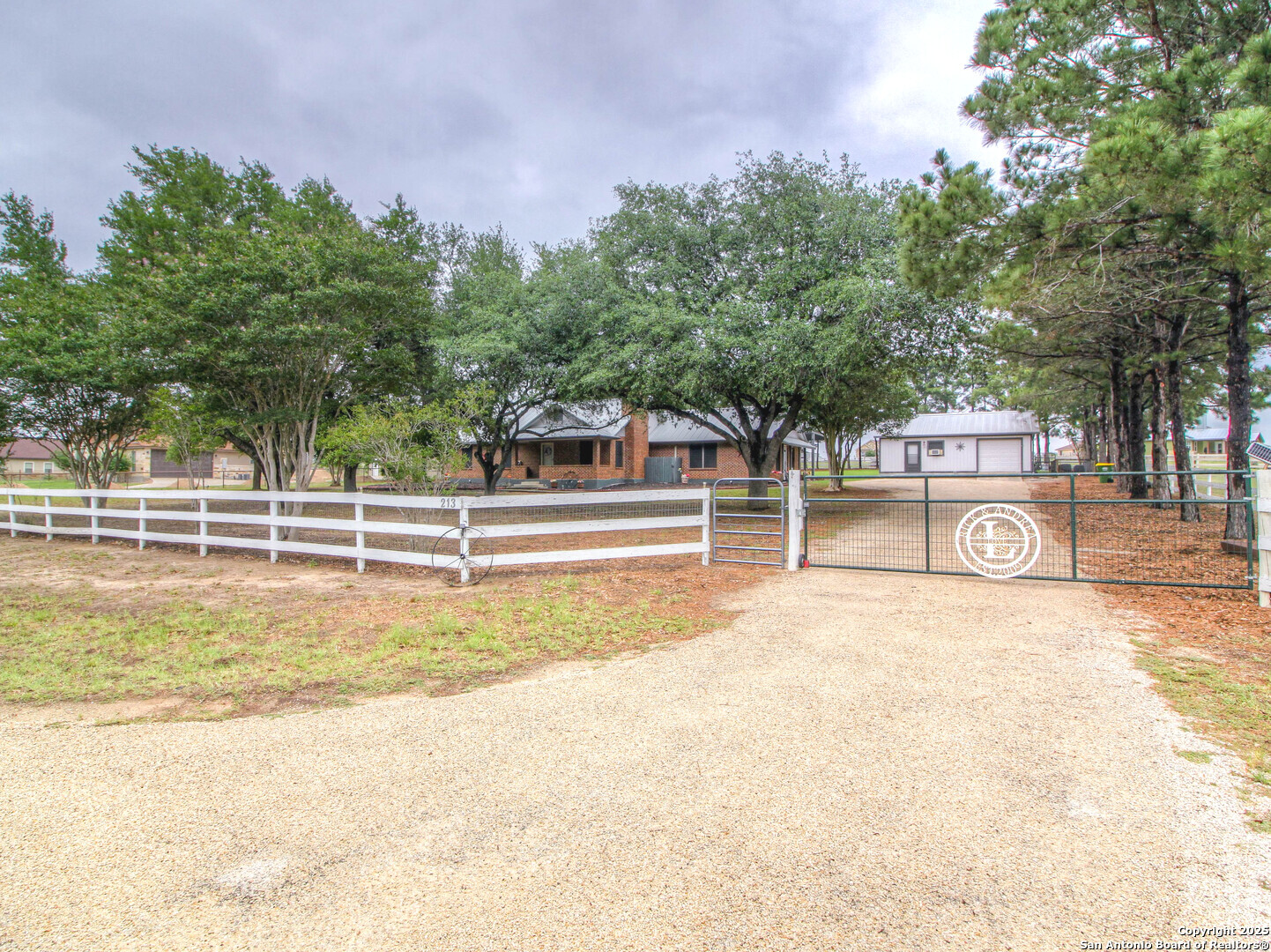 213 Bluebonnet Road La Vernia, TX 78121 - Photo 1 of 48 a view of a swimming pool with an outdoor space and seating area