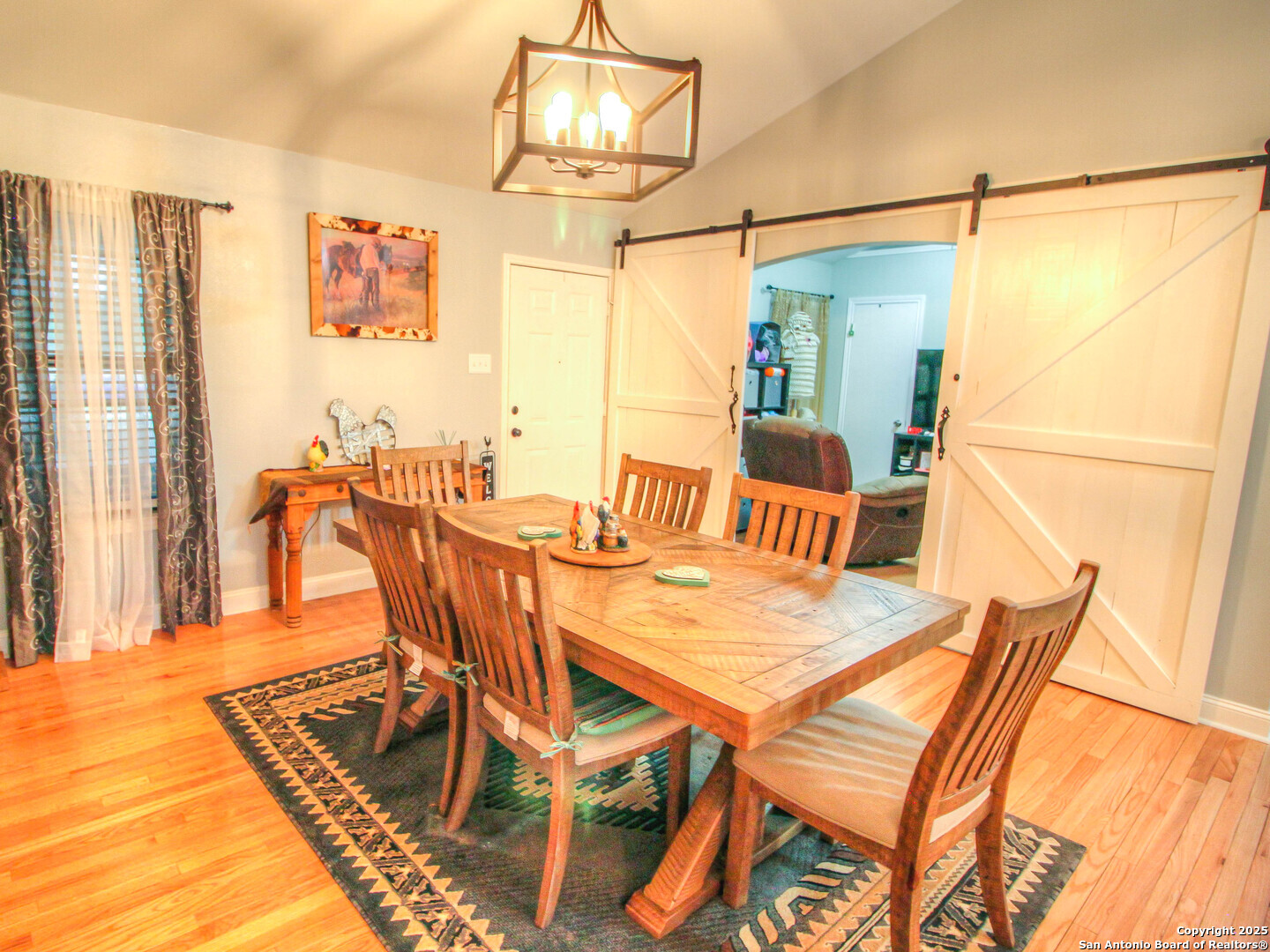 213 Bluebonnet Road La Vernia, TX 78121 - Photo 13 of 48 a dining room with furniture and window