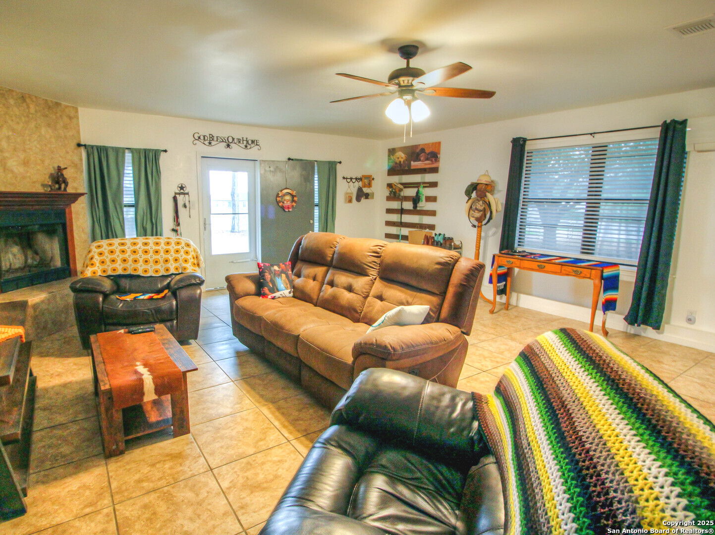 213 Bluebonnet Road La Vernia, TX 78121 - Photo 15 of 48 a living room with furniture and a flat screen tv