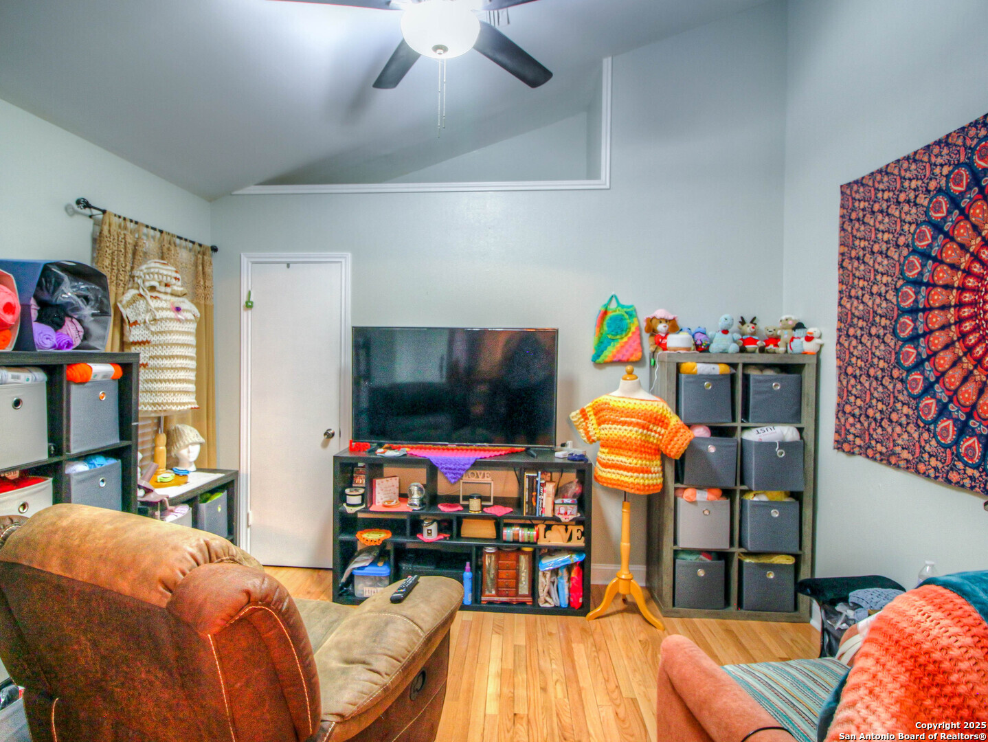 213 Bluebonnet Road La Vernia, TX 78121 - Photo 18 of 48 a bedroom with furniture and a flat screen tv