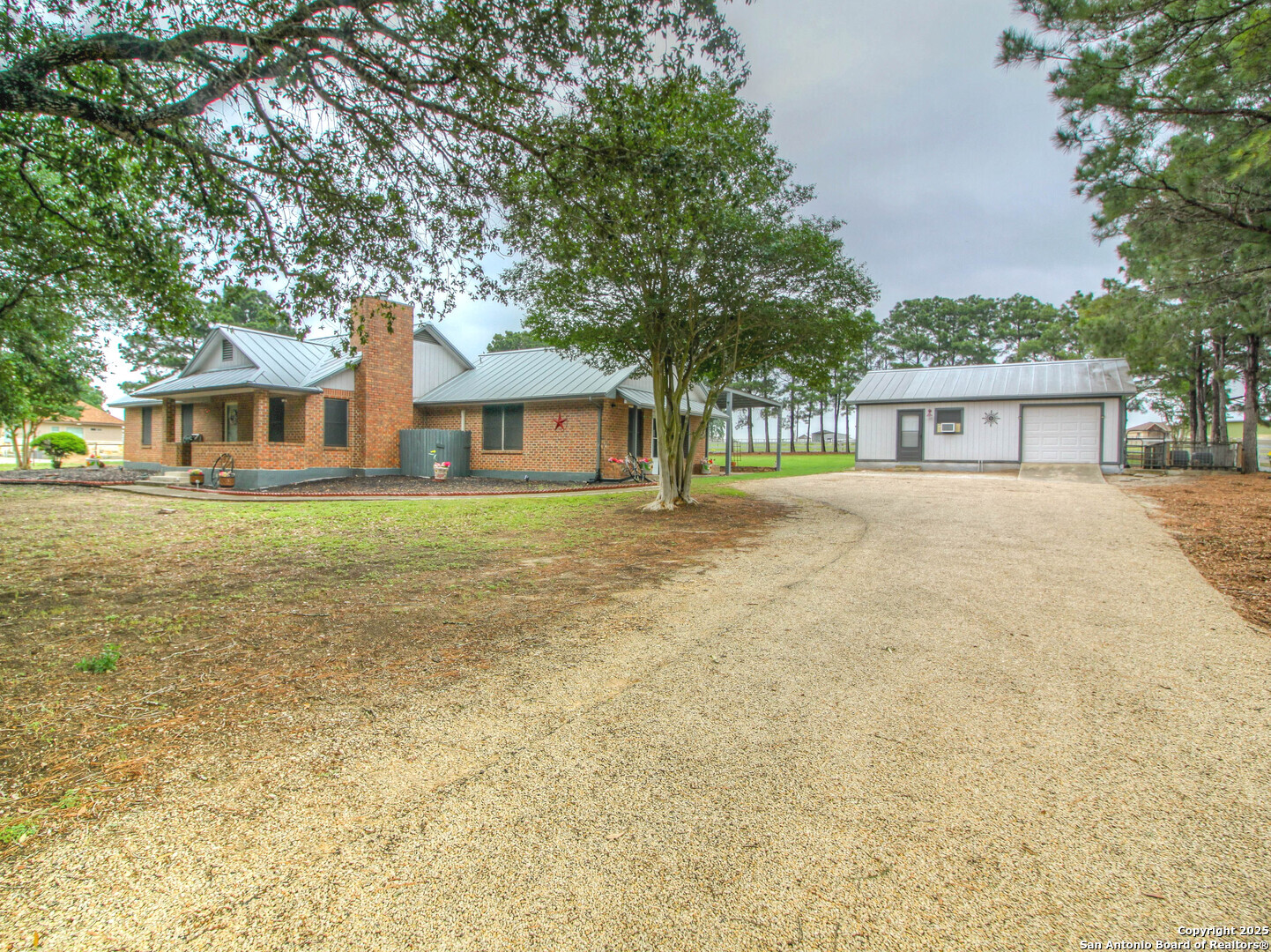 213 Bluebonnet Road La Vernia, TX 78121 - Photo 2 of 48 front view of a house with a yard