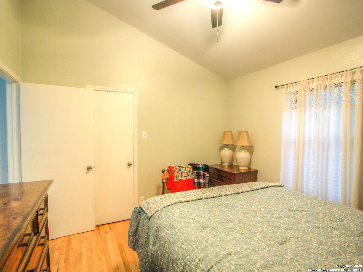 213 Bluebonnet Road La Vernia, TX 78121 - Photo 21 of 48 a bedroom with a bed and a dresser