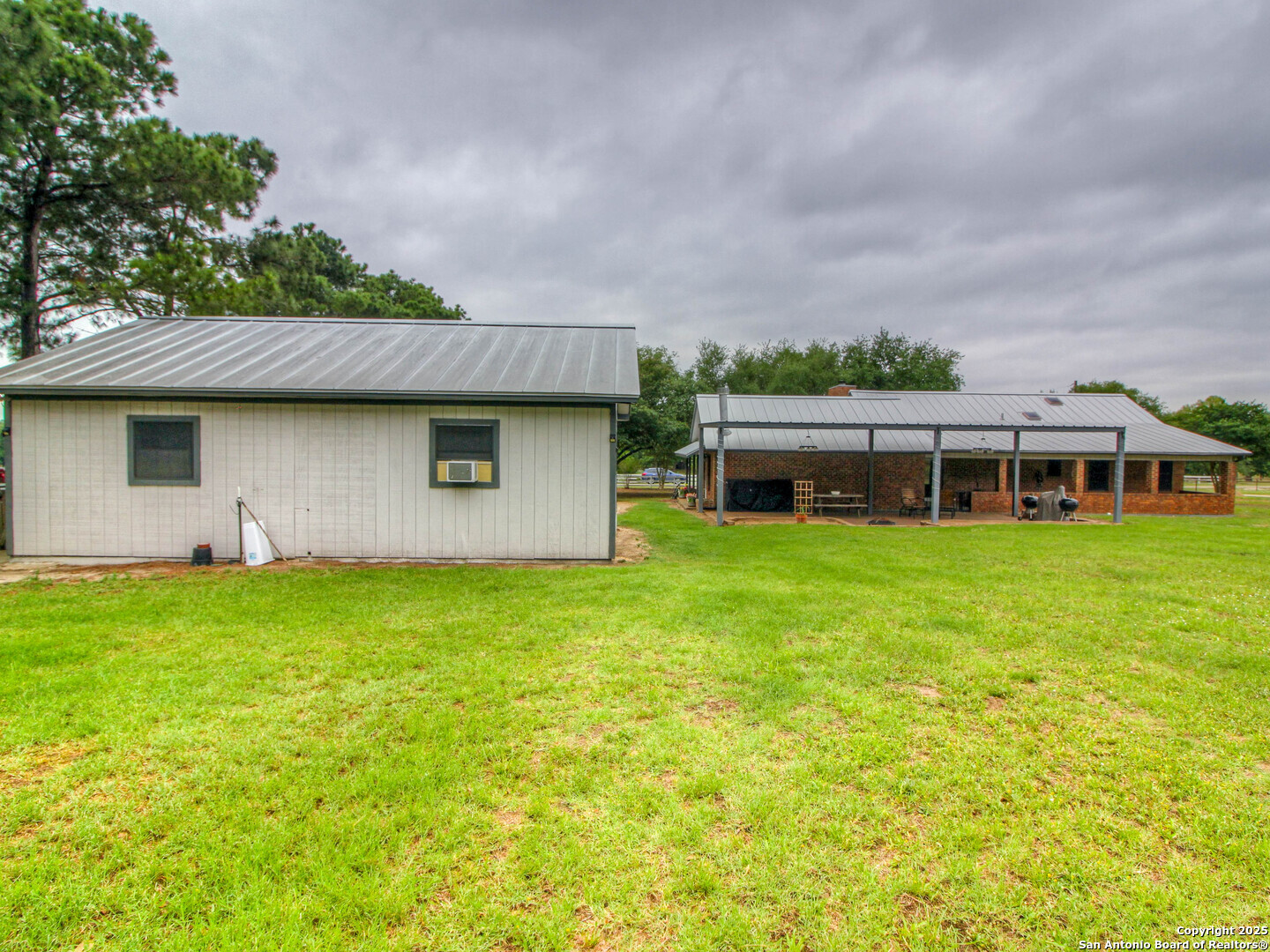 213 Bluebonnet Road La Vernia, TX 78121 - Photo 26 of 48 a front view of a house with garden
