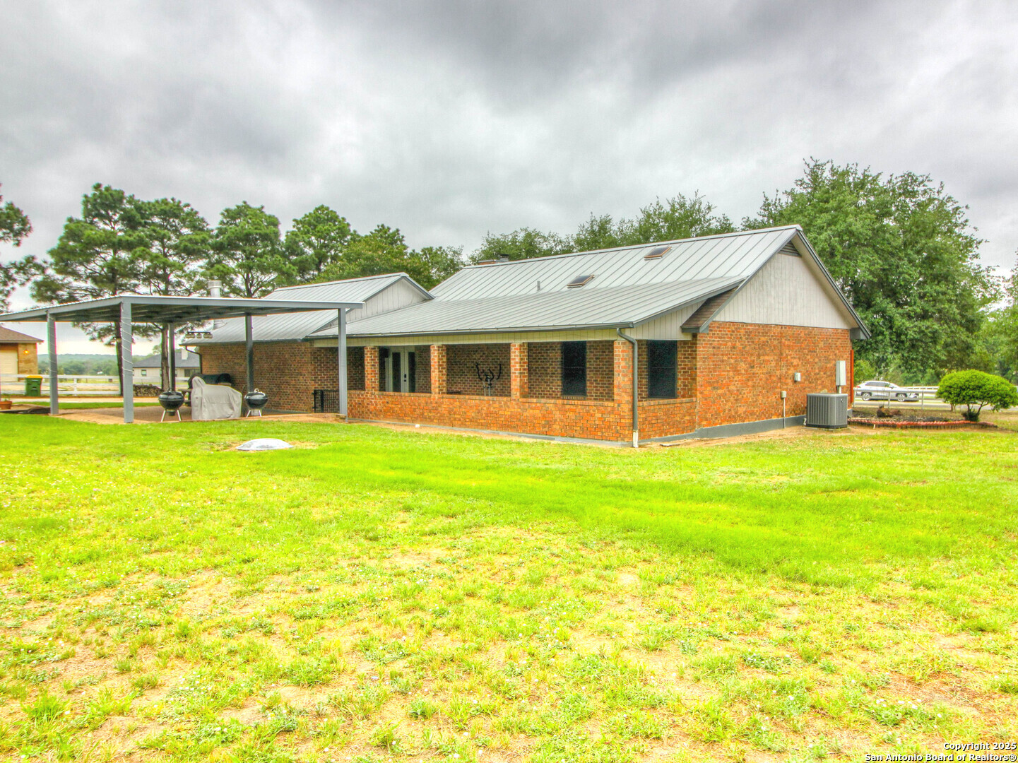 213 Bluebonnet Road La Vernia, TX 78121 - Photo 28 of 48 a front view of house with yard and seating area
