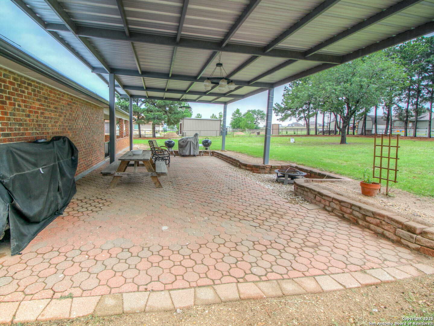 213 Bluebonnet Road La Vernia, TX 78121 - Photo 34 of 48 a view of a backyard with sitting area