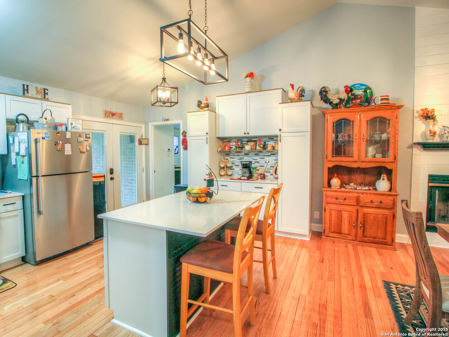 213 Bluebonnet Road La Vernia, TX 78121 - Photo 4 of 48 a kitchen with stainless steel appliances granite countertop a refrigerator and microwave
