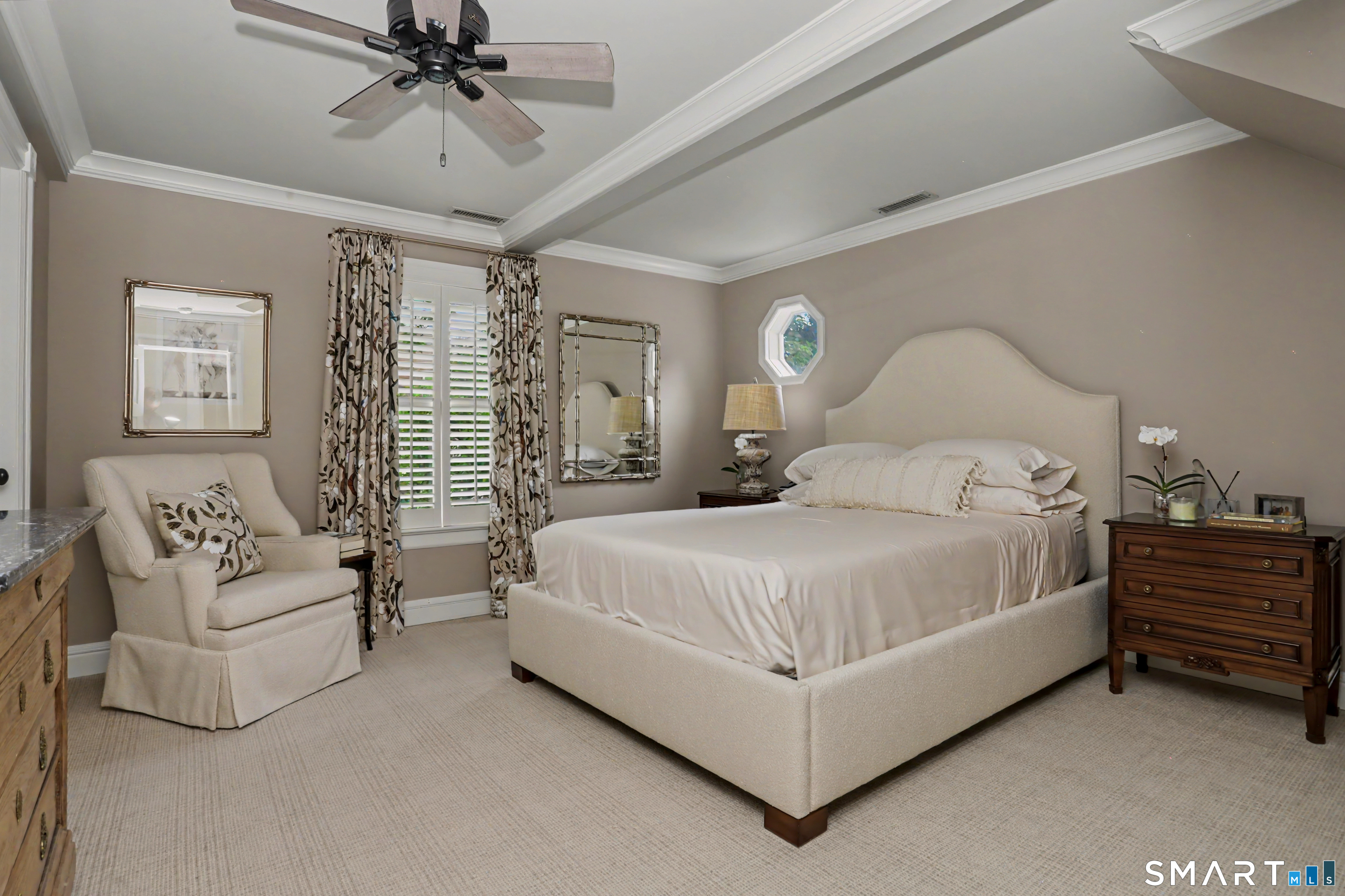 36 Catoonah Street, Unit 18 Ridgefield, CT 06877 - Photo 20 of 40 a bedroom with a large bed and a chandelier