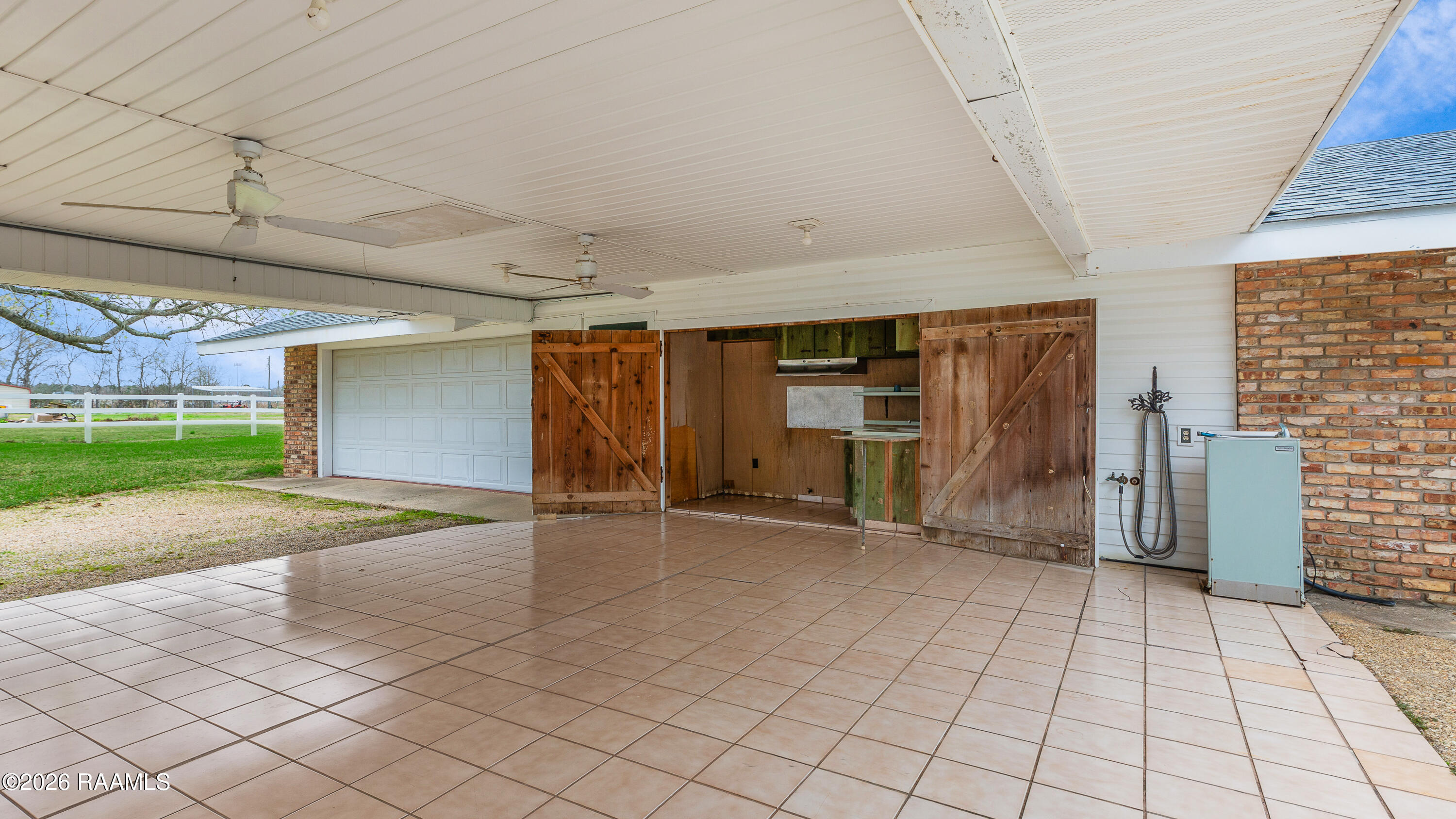 3672 Highway 3043 Opelousas, LA 70570 - Photo 28 of 37 Back patio, garage and sink area