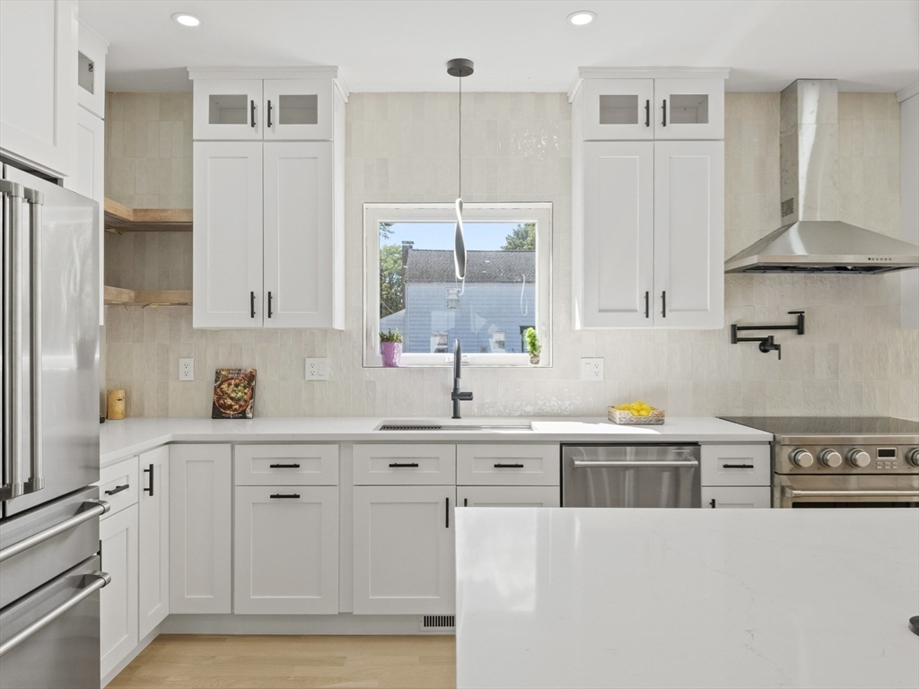 10 Ames Street Wakefield, MA 01880 - Photo 13 of 42 a kitchen with cabinets and wooden floor