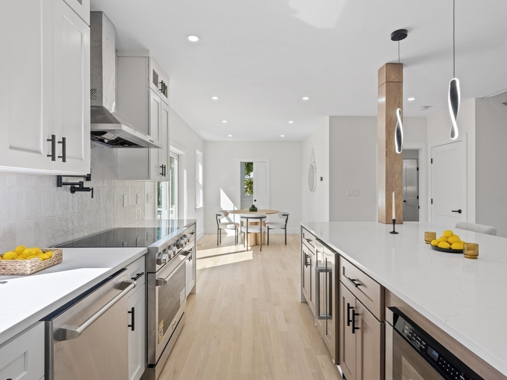 10 Ames Street Wakefield, MA 01880 - Photo 14 of 42 a kitchen with a sink appliances and cabinets