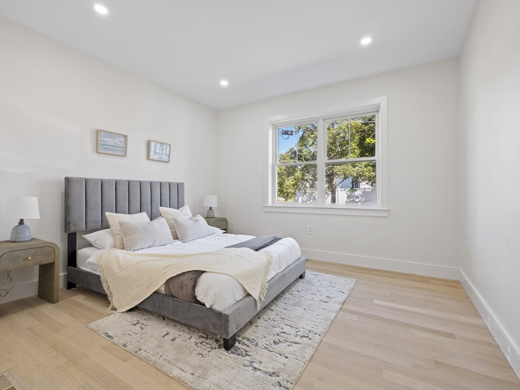 10 Ames Street Wakefield, MA 01880 - Photo 20 of 42 a bedroom with a large bed and a window