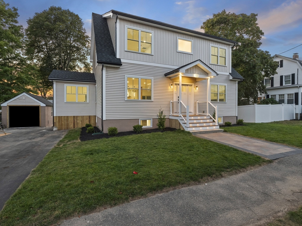 10 Ames Street Wakefield, MA 01880 - Photo 2 of 42 a front view of a house with a yard