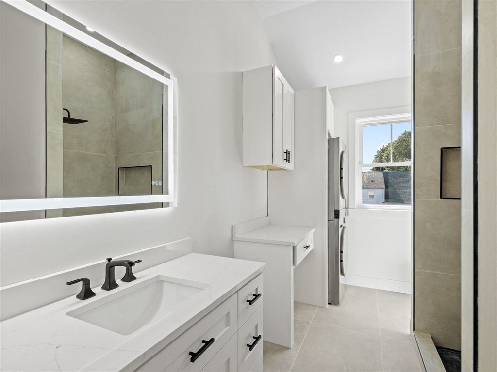 10 Ames Street Wakefield, MA 01880 - Photo 30 of 42 a bathroom with a sink and a mirror