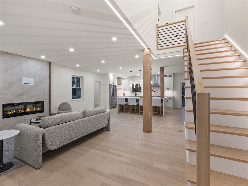 10 Ames Street Wakefield, MA 01880 - Photo 3 of 42 a living room with furniture and a wooden floor