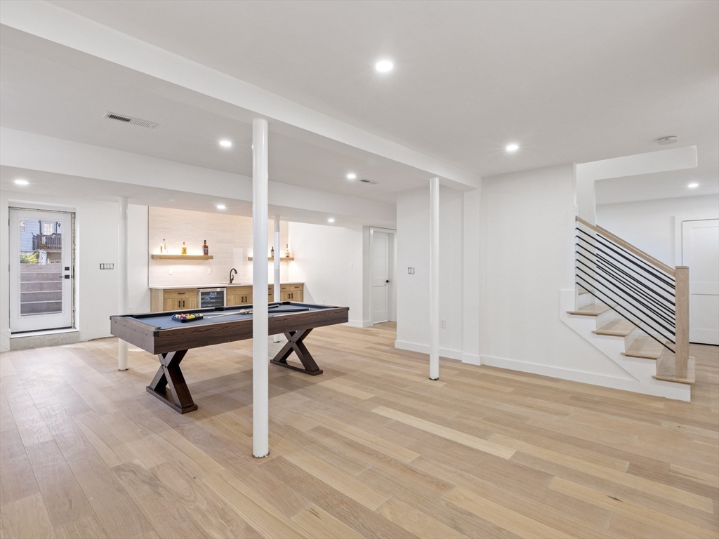 10 Ames Street Wakefield, MA 01880 - Photo 38 of 42 a room with lots of furniture and windows