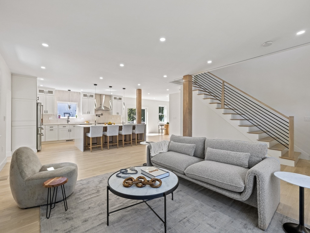 10 Ames Street Wakefield, MA 01880 - Photo 5 of 42 a living room with furniture kitchen view and wood floor