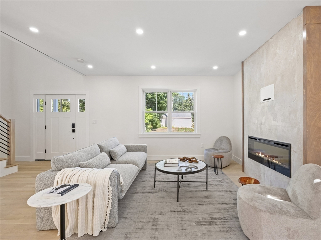 10 Ames Street Wakefield, MA 01880 - Photo 6 of 42 a living room with furniture and a table