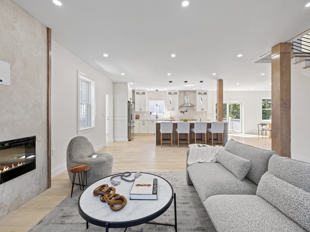 10 Ames Street Wakefield, MA 01880 - Photo 8 of 42 a living room with furniture and a fireplace