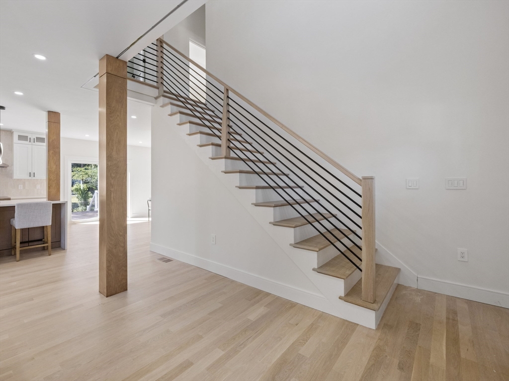 10 Ames Street Wakefield, MA 01880 - Photo 9 of 42 a view of entryway and hall with wooden floor