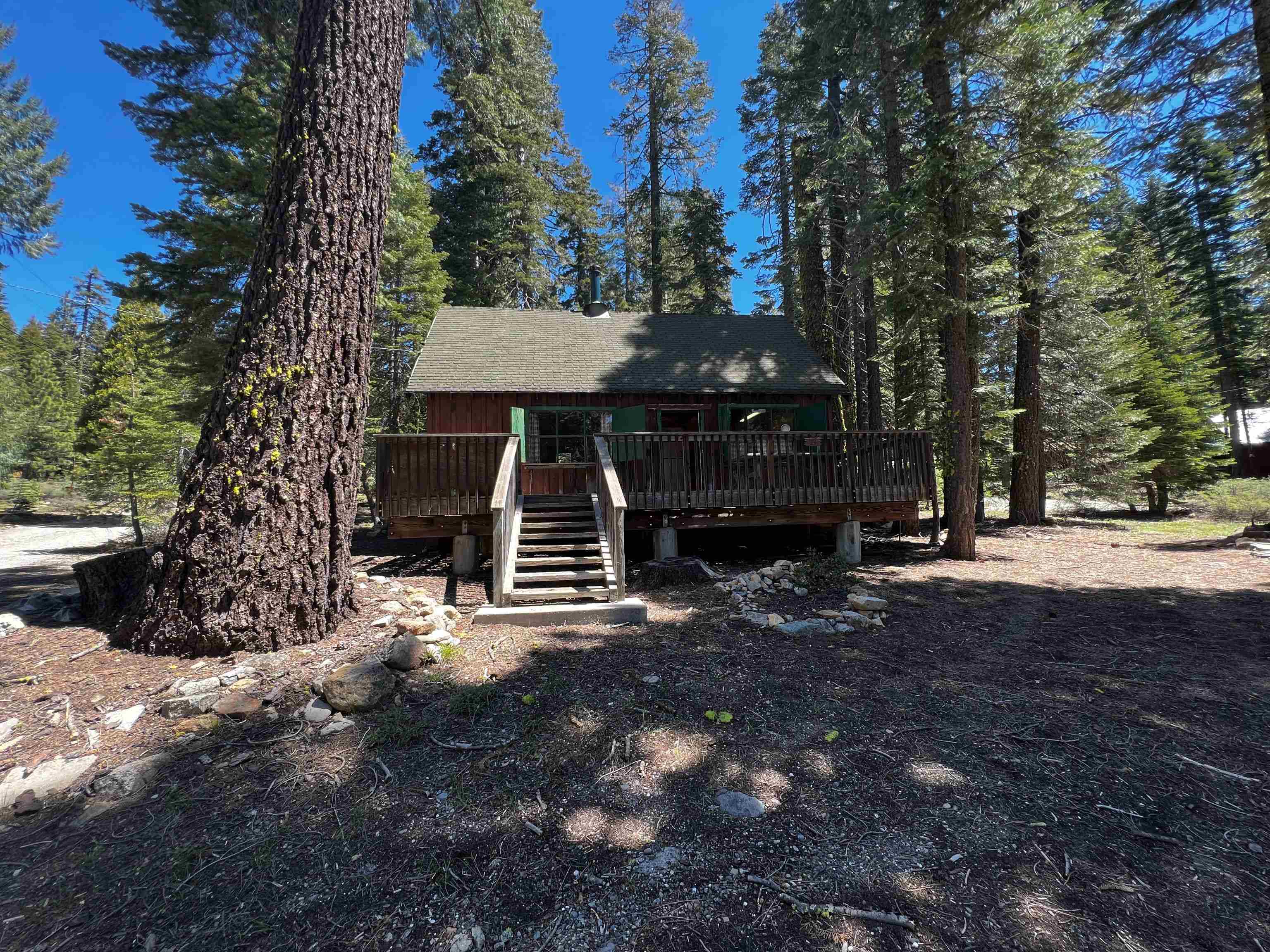 23 Haskell Creek Road, Unit 23 Calpine, CA 96124 - Photo 2 of 15 a view of house with trees in the background
