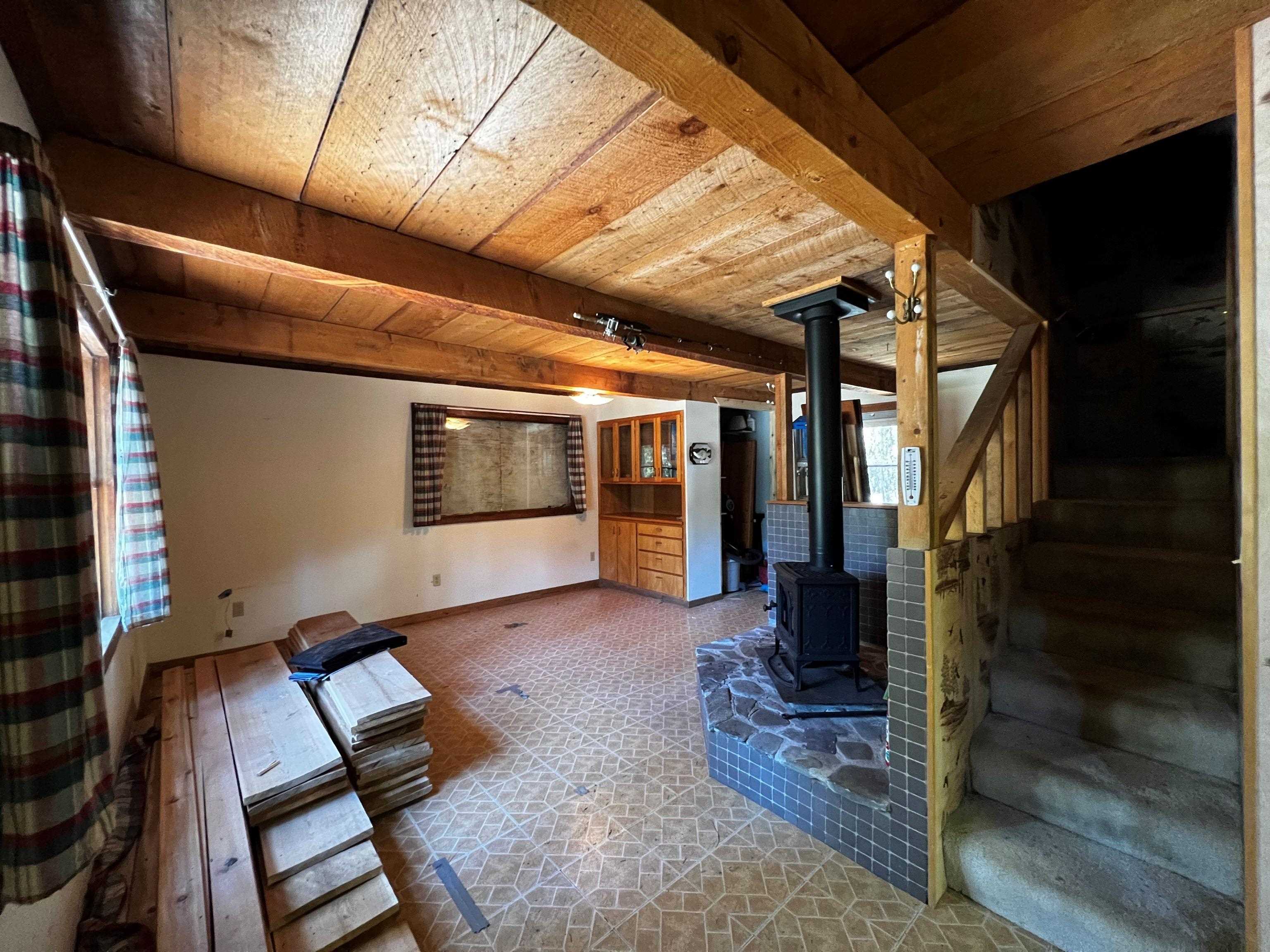 23 Haskell Creek Road, Unit 23 Calpine, CA 96124 - Photo 4 of 15 a view of an empty room with wooden floor