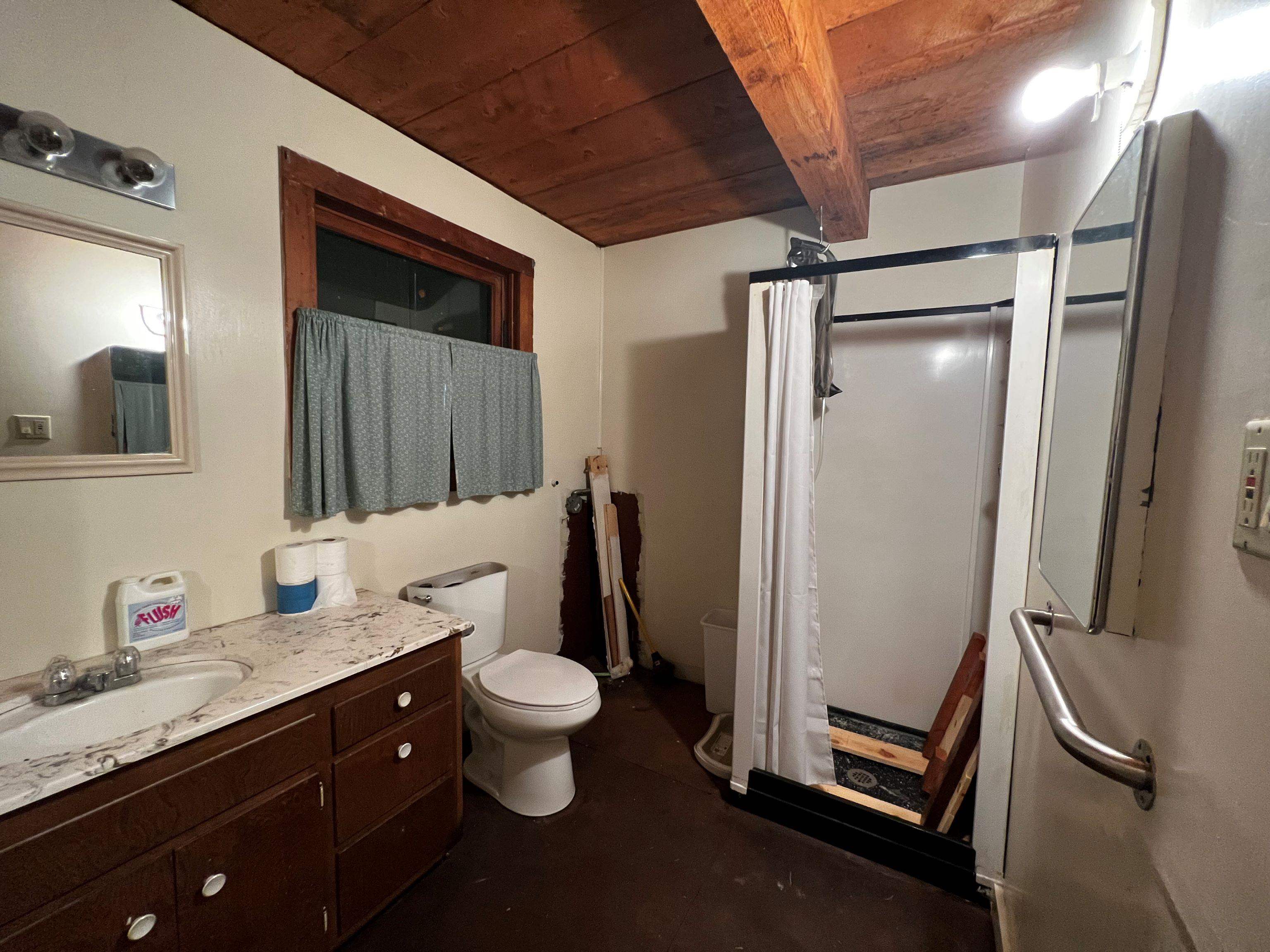 23 Haskell Creek Road, Unit 23 Calpine, CA 96124 - Photo 7 of 15 a bathroom with a granite countertop sink toilet and shower