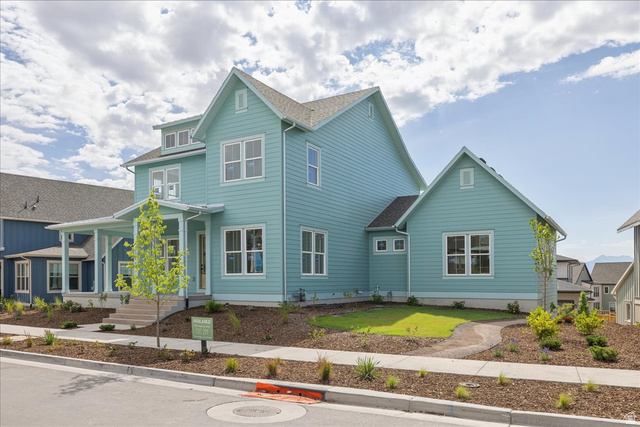 7189 South Sage Road, Unit 214 West Jordan, UT 84081 - Photo 2 of 29 Two-story residence featuring light blue siding with white trim