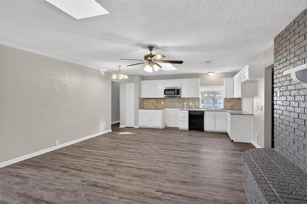 701 Harrison Lane Hurst, TX 76053 - Photo 15 of 29 a view of kitchen with granite countertop cabinets and stainless steel appliances