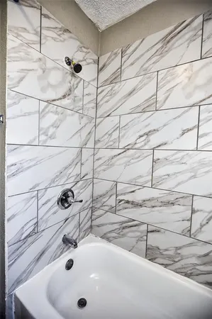 a bathroom with a sink and a shower