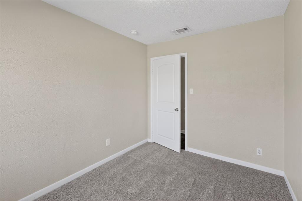 701 Harrison Lane Hurst, TX 76053 - Photo 9 of 29 a view of an empty room