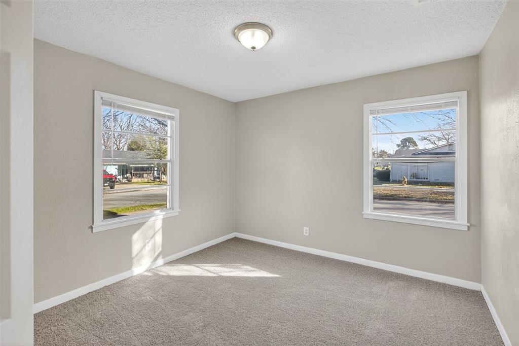 701 Harrison Lane Hurst, TX 76053 - Photo 10 of 29 a view of an empty room with a window