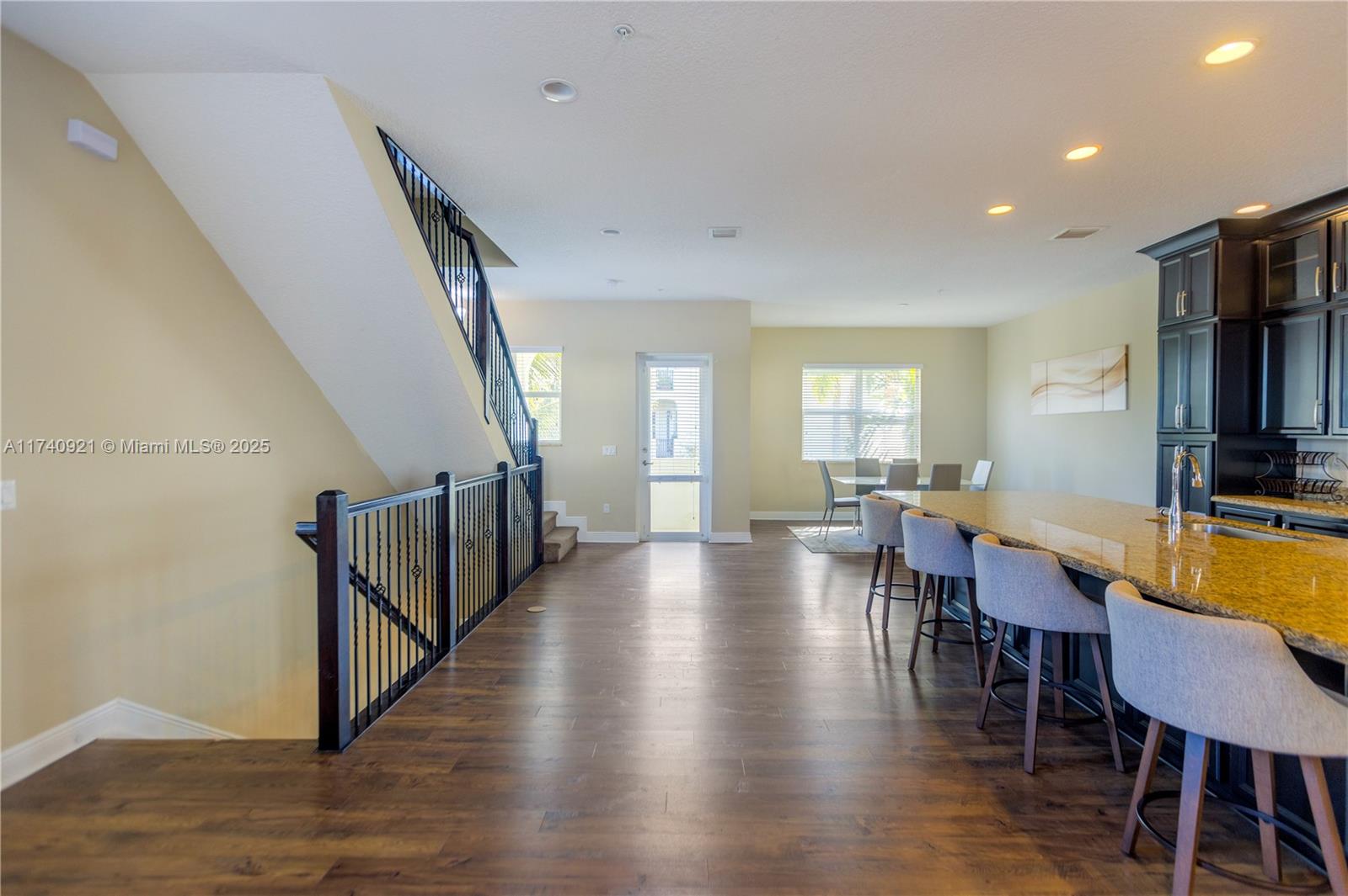 1799 Northwest 124th Way, Unit 1799 Pembroke Pines, FL 33028 - Photo 13 of 40 a view of a a dining room with furniture window and wooden floor