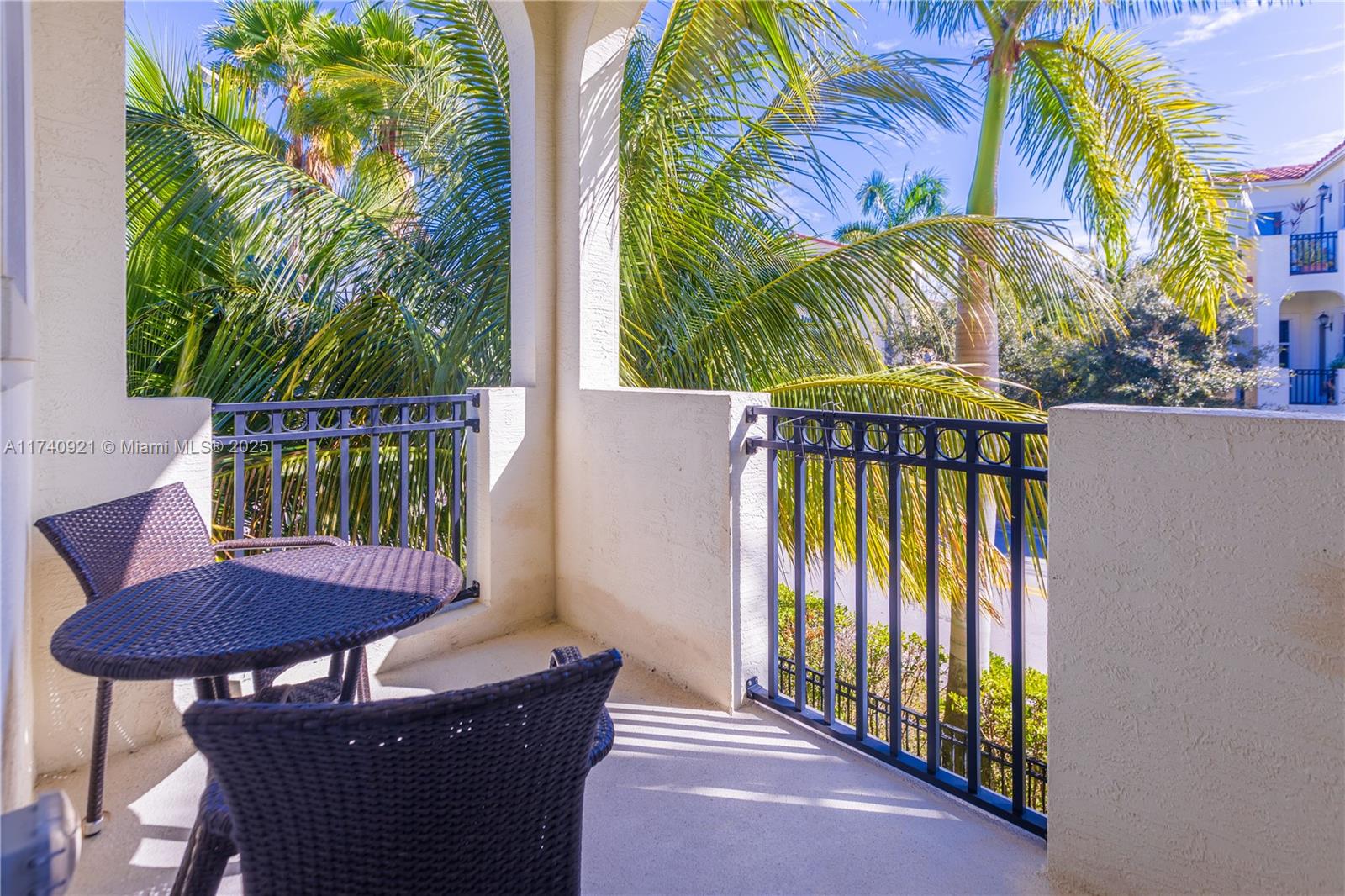 1799 Northwest 124th Way, Unit 1799 Pembroke Pines, FL 33028 - Photo 17 of 40 a view of a chairs and table in the balcony