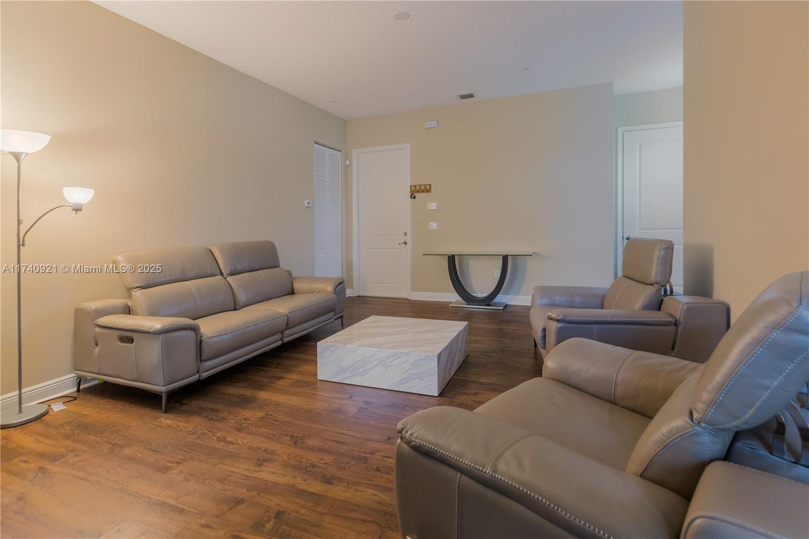 1799 Northwest 124th Way, Unit 1799 Pembroke Pines, FL 33028 - Photo 39 of 40 a living room with furniture and a couch