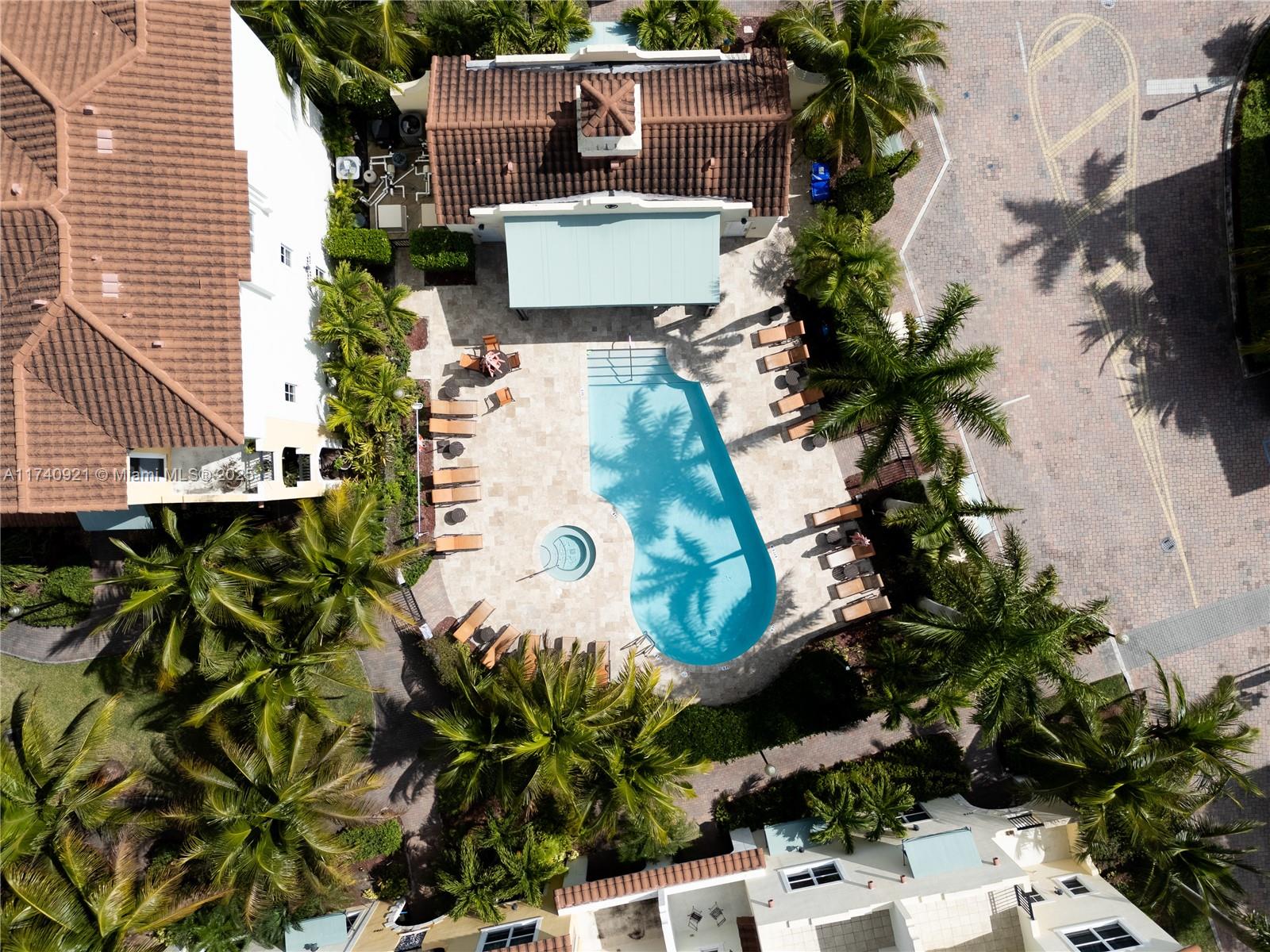 1799 Northwest 124th Way, Unit 1799 Pembroke Pines, FL 33028 - Photo 5 of 40 an aerial view of a house with a garden