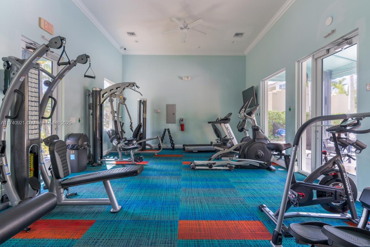 1799 Northwest 124th Way, Unit 1799 Pembroke Pines, FL 33028 - Photo 9 of 40 a view of a room with gym equipment