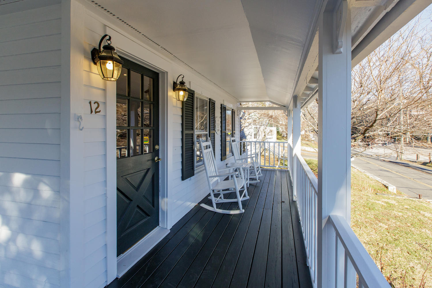 12 Roton Avenue Rowayton, CT 06853 - Photo 4 of 31 a view of a balcony with wooden floor and furniture