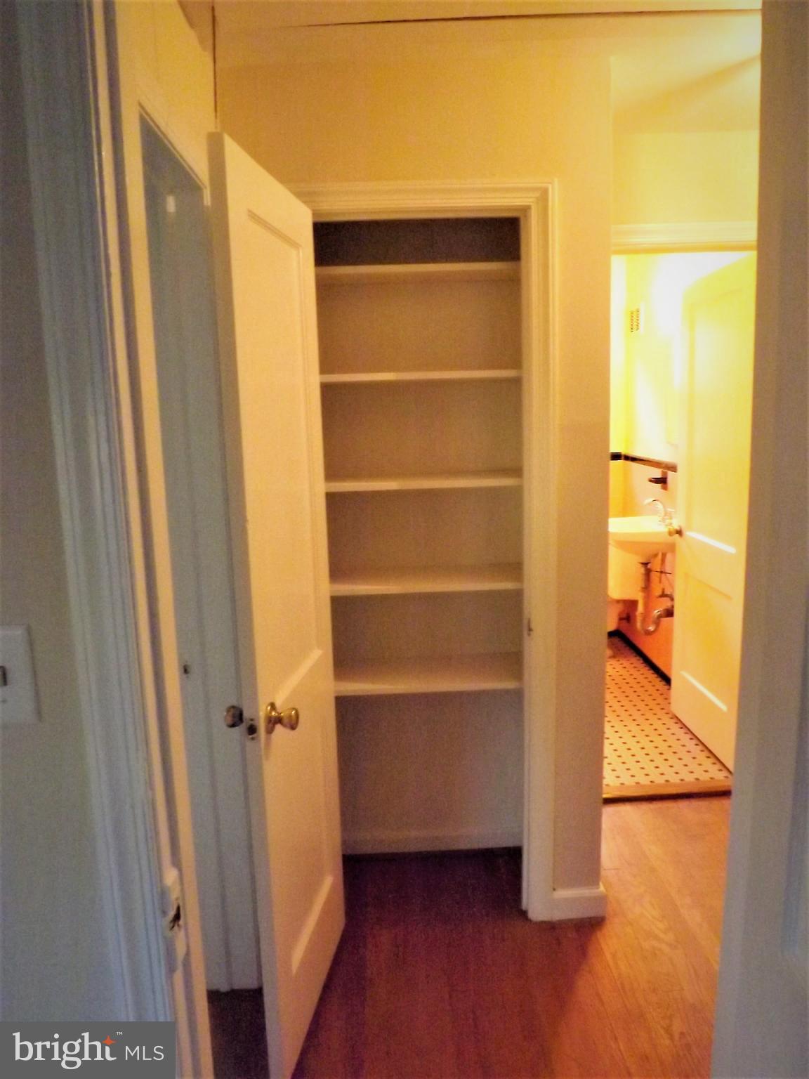 11936 Bluhill Road Silver Spring, MD 20902 - Photo 15 of 30 a view of walk in closet with empty racks
