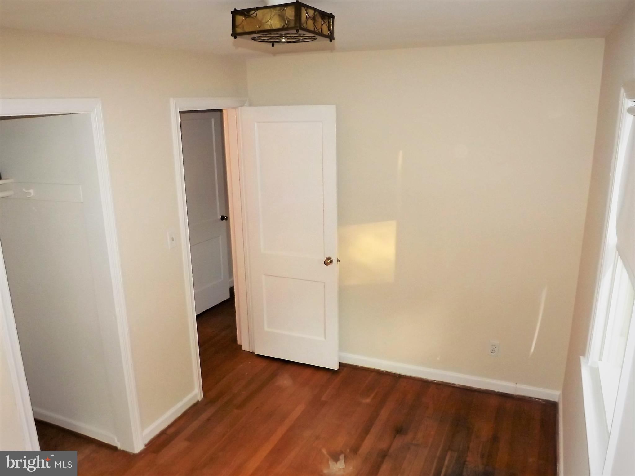 11936 Bluhill Road Silver Spring, MD 20902 - Photo 19 of 30 a view of an empty room with wooden floor
