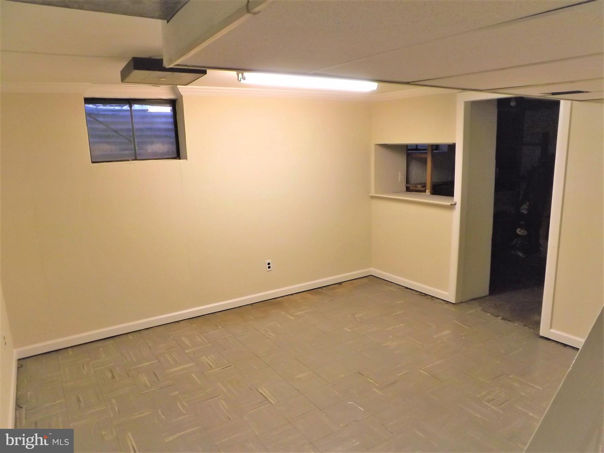 11936 Bluhill Road Silver Spring, MD 20902 - Photo 22 of 30 a view of an empty room with a window